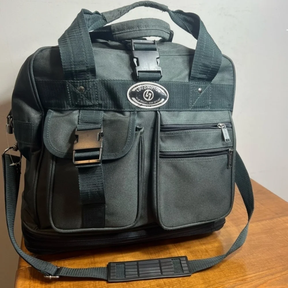 Vintage Locomotor expandable carry on luggage with wheels.